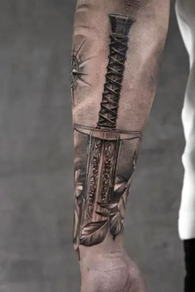 100 Amazing Tattoo Designs for Men You Must Try! 38 Angel Blade Tattoo With Wrath