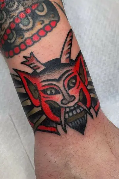 100 Amazing Tattoo Designs for Men You Must Try! 56 Devil Thread Tattoo With Temptation