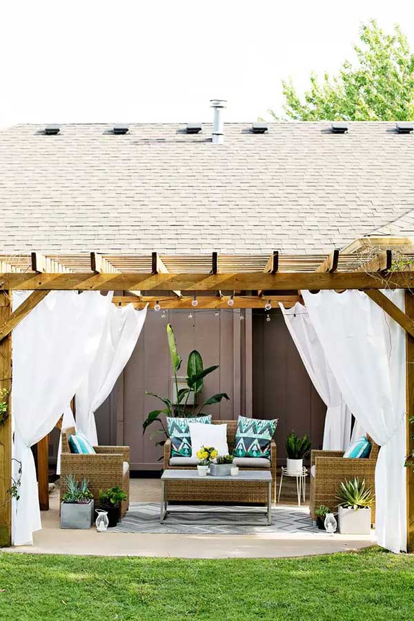44 Back Patio Ideas on a Budget to Transform Small Outdoor Spaces 17 Hang Curtains on a Pergola