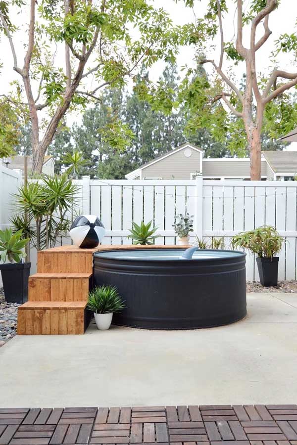 44 Back Patio Ideas on a Budget to Transform Small Outdoor Spaces 24 Install a Stock Tank Pool