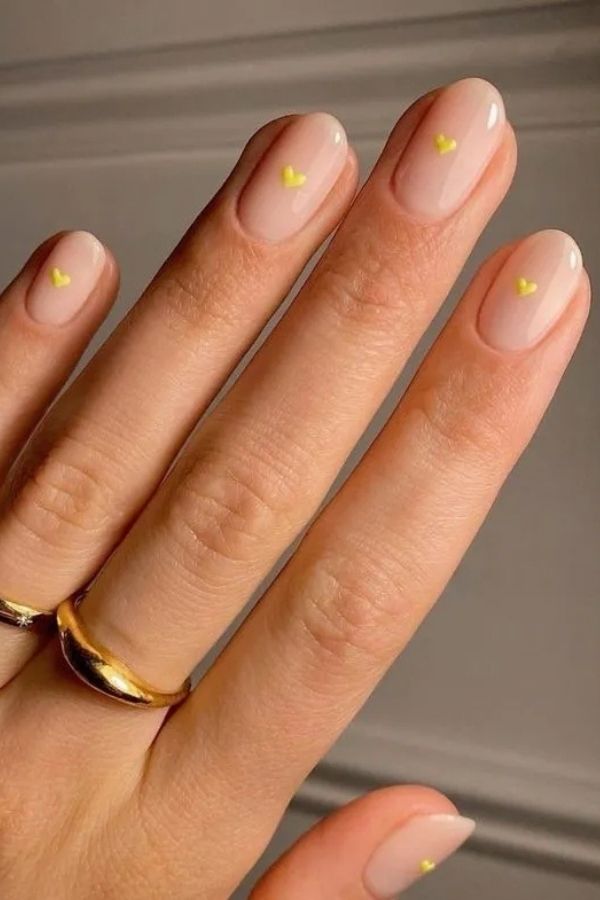 34 Soft to Bold Cutest Yellow Nail Designs Ideas Perfect for Summer and Beyond 12 Mini Yellow Hearts Manicure