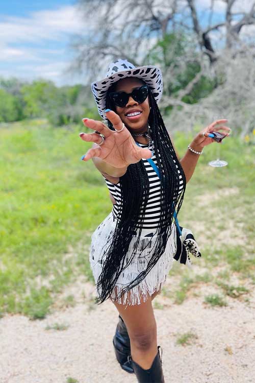 30 Black Cowgirl Outfits for Black Women That Redefine Western Style 2 Playful Fringe Meets Cow Print Chic
