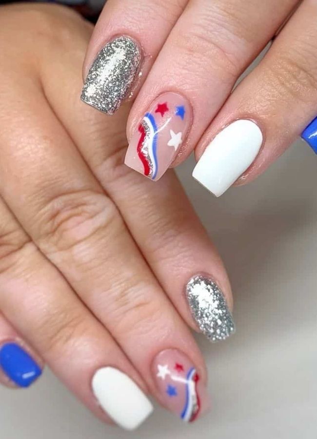 59 Elegant 4th Of July Nails Patriotic Nail Designs You Must Try on Independence Day 24 Red and Blue Nails with Glitter Accents