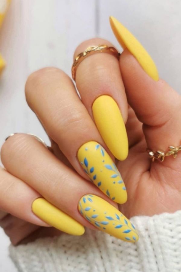 34 Soft to Bold Cutest Yellow Nail Designs Ideas Perfect for Summer and Beyond 14 Yellow Blue Leaf Mani Design