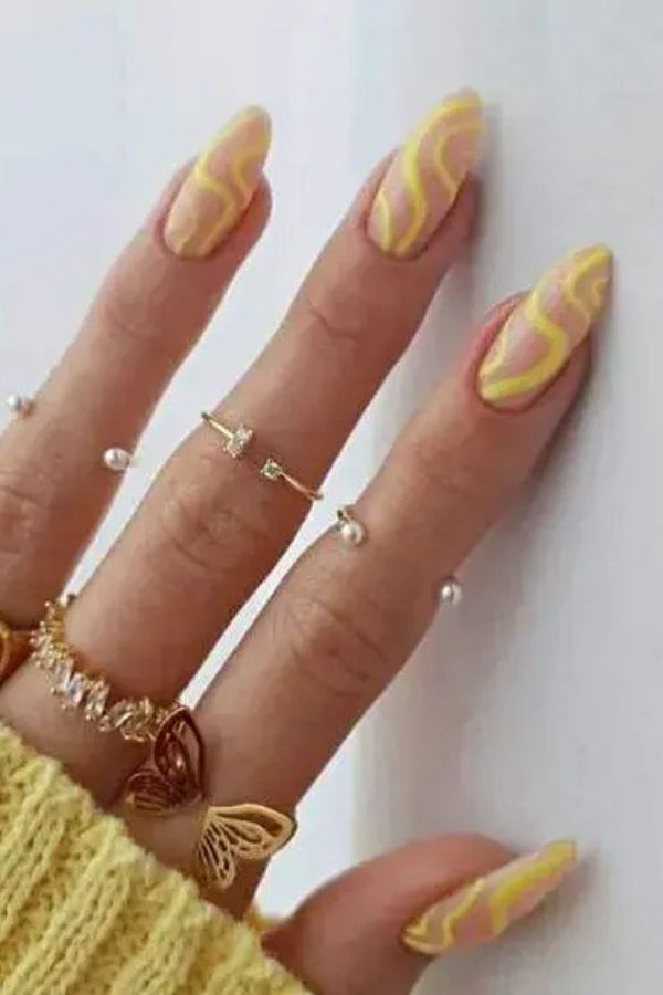 34 Soft to Bold Cutest Yellow Nail Designs Ideas Perfect for Summer and Beyond 15 Yellow Swirly Nails