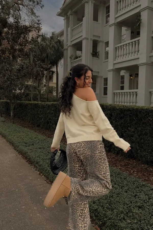 51 Stylish Fall Outfit Ideas for Woman Who Want Comfort and Class 6 Bold One-Shoulder Jumper Styled with Leopard Pants