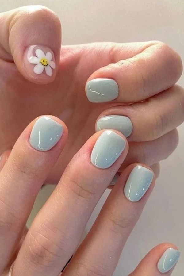 36 Subtle Yet Cute Minimal Nail Designs Mani Ideas You’ll Love to Wear 31 Single Daisy Accent Thumb Nail Design