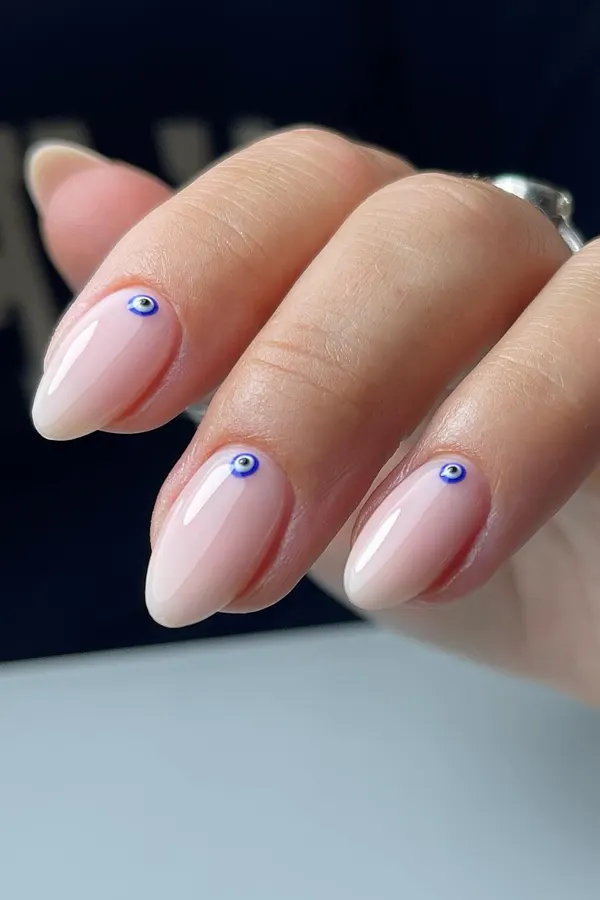 44 Simple Clear Nail Designs For Fresh, Clean, and Modern Mani Look 6 Evil Eye Good Luck Nail Art