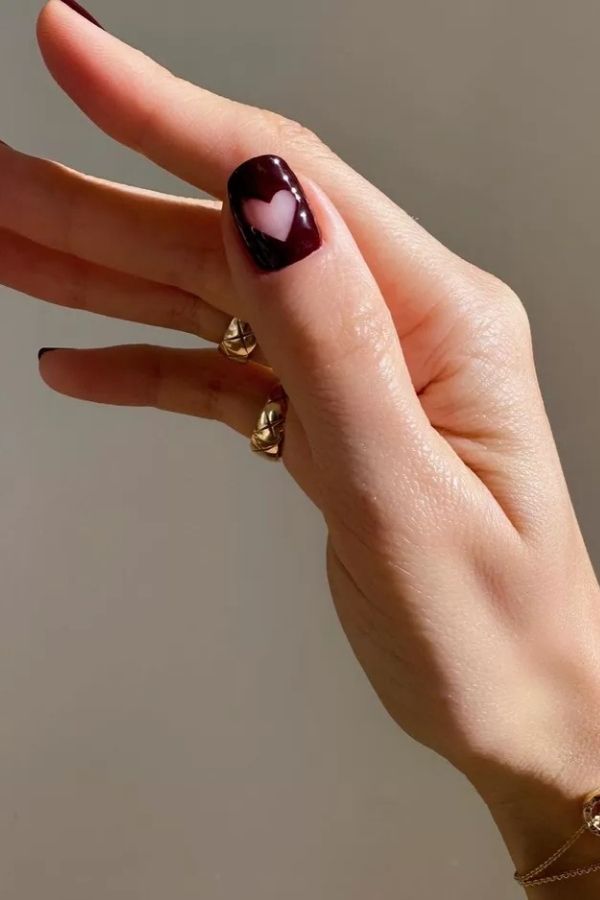 36 Subtle Yet Cute Minimal Nail Designs Mani Ideas You’ll Love to Wear 4 Heart Accent on Burgundy
