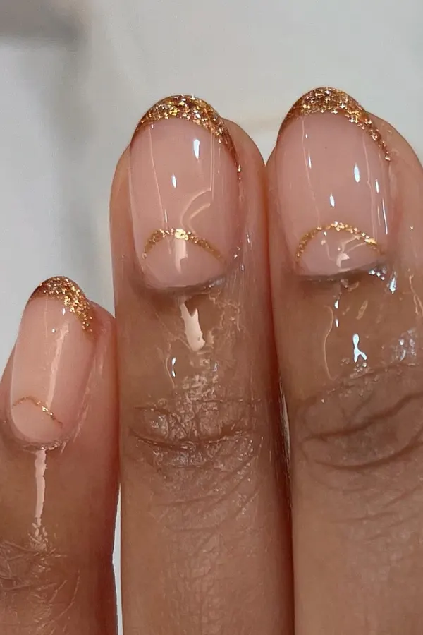 44 Simple Clear Nail Designs For Fresh, Clean, and Modern Mani Look 10 Minimal Half-Moon Gold Glitter French Tips