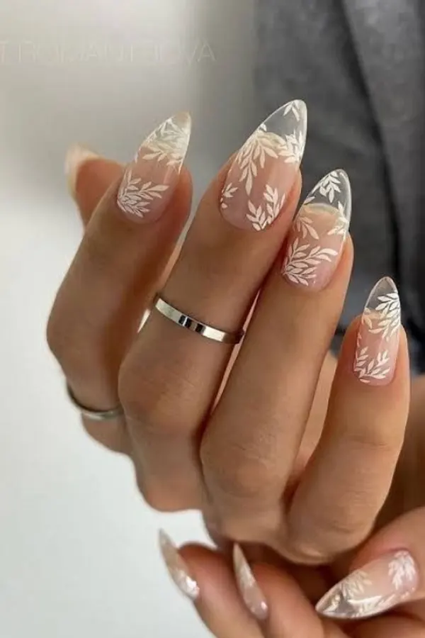 37. Glam Fall Wedding Nail Ideas For Guests & Bride That Look Great in Every Photo 29 Nature-Inspired White Leaf Nail Art