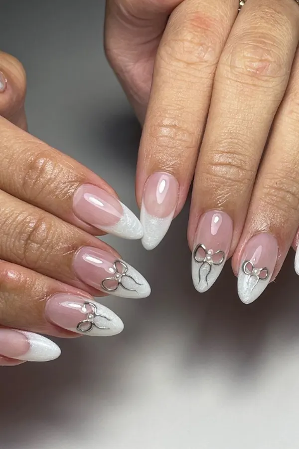 37. Glam Fall Wedding Nail Ideas For Guests & Bride That Look Great in Every Photo 7 Playful Silver Bow Nails for Wedding Looks