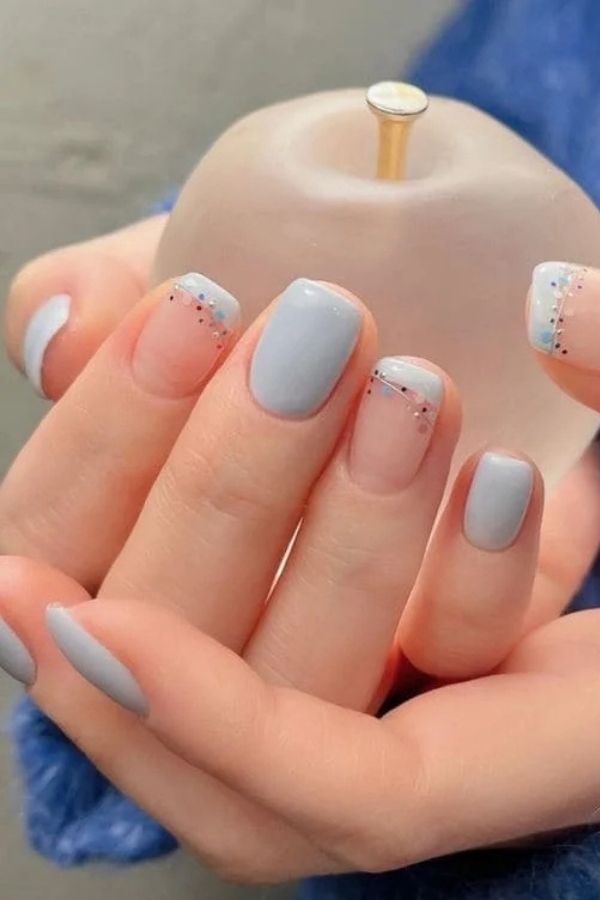 36 Subtle Yet Cute Minimal Nail Designs Mani Ideas You’ll Love to Wear 7 Soft Blue with Glitter Detail