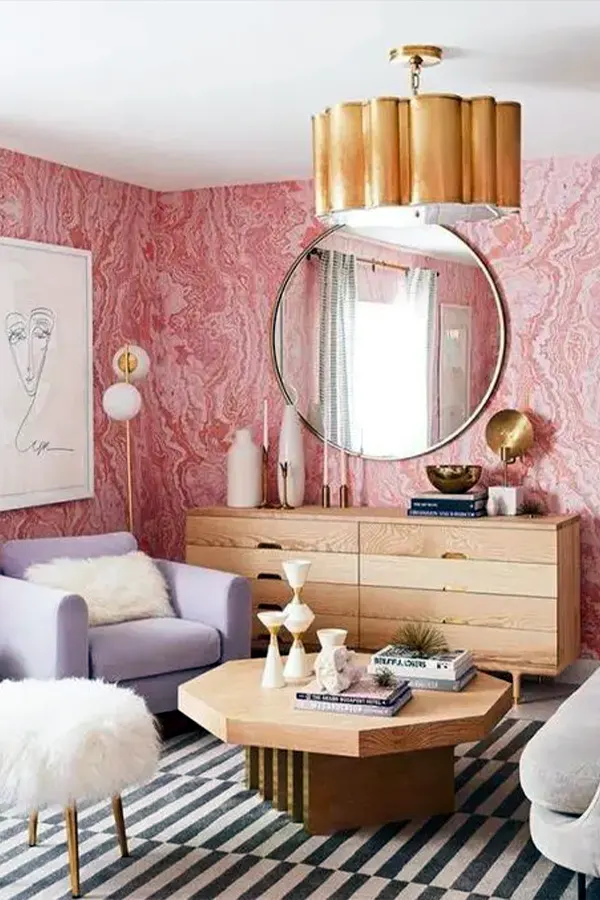 Chic Pink Living Room With Prints and Gold