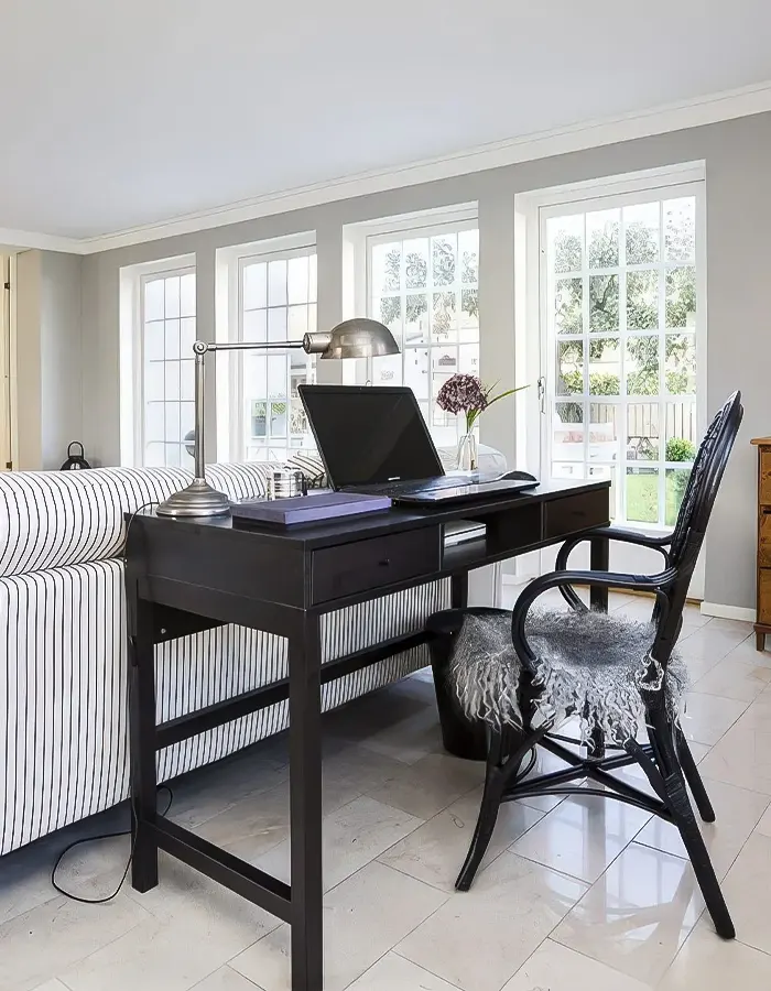 Contrasting Black Desk in Rustic Living Room